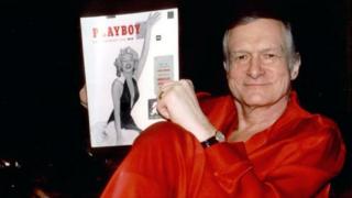 Playboy founder Hugh Hefner with the first copy of the magazine. File photo