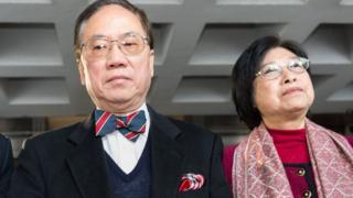 Former Hong Kong chief executive Donald Tsang (L) and his wife Selina (R) leave the High Court as the jury adjourns to deliberate a verdict in his high-profile corruption trial in Hong Kong on February 16, 2017.