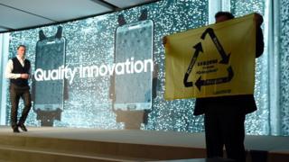 Greenpeace protester on Samsung stage at Mobile World Congress