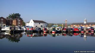Canal boats on a still river