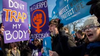 Pro-choice advocates (left) and anti-abortion advocates (right) rally outside of the Supreme Court, March 2, 2016 in Washington, DC