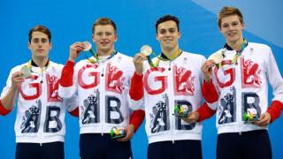 Chris Walker-Hebborn, Adam Peaty, James Guy and Duncan Scott with silver medals