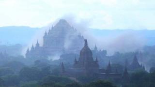 The ancient Dhammayangyi temple is seen shrouded in dust as a 6.8 magnitude earthquake hit Bagan on August 24, 2016