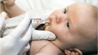 Baby being given rotavirus vaccine