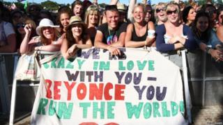 Fans with a Beyonce banner at Glastonbury
