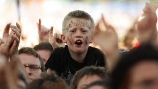 Boy in crowd at Glastonbury