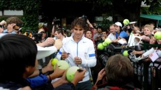 Nadal in the grounds signing hi autograph