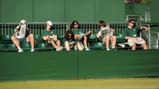 Ground staff relax in the sun