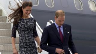 The Duke and Duchess of Cambridge, Prince William and Kate, walk down the stairs of their aircraft upon their arrival in Ottawa, Canada