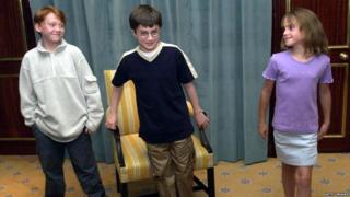 Actors Emma Watson, Rupert Grint and Daniel Radcliffe attend a photocall to present the new cast of the Harry Potter Films on August 23, 2000 in London