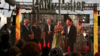 Harry Potter stars speaking on stage at the Deathly Hallows Part 2 premiere