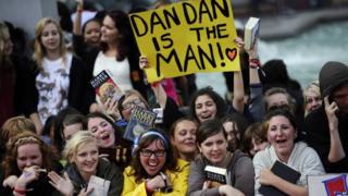 Fans holding sign asking for Daniel Radcliffe