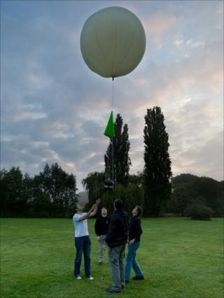 The team launching their meteorological weather balloon.