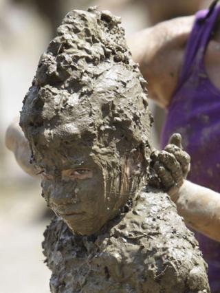 Karen playing at the annual Mud Day in Michigan