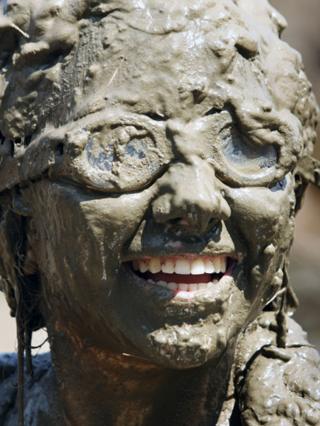 A girl enjoying Mud Day in Michigan