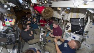 Crew having a last supper on the ISS