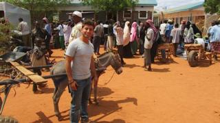 Ricky with a donkey in Dadaab
