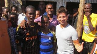 Ricky with young footie fans in the centre of Dadaab