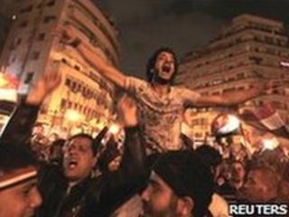 Protesters celebrate the news of Mubarak's resignation