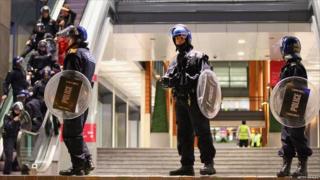 Police stand guard at the Mailbox shopping centre in Birmingham