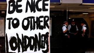 A sign urging Londoners to be nice to each other is pictured near an Underground station in north London
