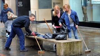 Young volunteers help the clean-up effort in Manchester