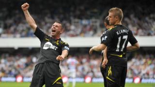 Bolton's Gary Cahill celebrates after Ivan Klasnic scored their third goal during the Premier League match at Loftus Road