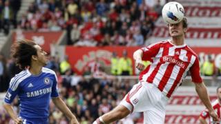 Stoke City's Danny Pugh challenges Chelsea's Yossi Benayoun during their English Premier League soccer match at the Britannia Stadium in Stoke