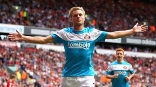 Sebastian Larsson of Sunderland celebrates scoring the equalising goal during the Premier League match between Liverpool and Sunderland at Anfield