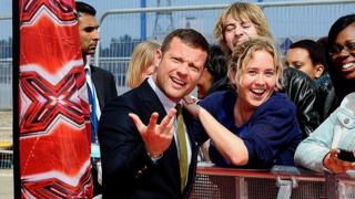 Dermot O'Leary poses with fans on the red carpet at the launch of the new series of The X Factor.