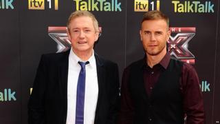 Louis Walsh and Gary Barlow pose on the red carpet for the new series of The X Factor.