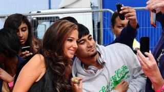 Tulisa Contostavlos greets fans on the red carpet for the launch of the new series of The X Factor.