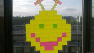 Smiley face made from sticky notes