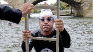 David Walliams climbs out of the River Thames