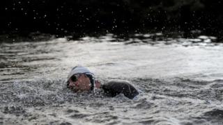 Rain pours down as David Walliams continues his charity swim of the River Thames for Sport Relief