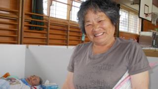 Yuhito's grandmother and grandfather in an evacuation centre.