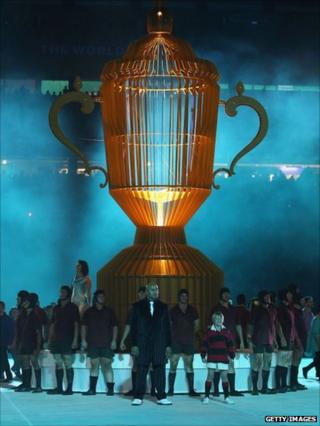 Former All Black star Jonah Lomu stands in front of a replica of the Webb Ellis Cup at Eden Park on 9 September 2011