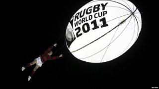 During the show, schoolboy Ethan Bai was hoisted 20 metres into the air to catch a huge glowing rugby ball.