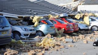 Cars outside a bakery in County Durham were crushed when a roof collapsed in high winds.