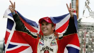 Dan Wheldon and flag