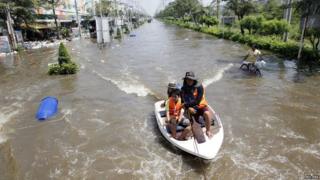 People being rescued by boat