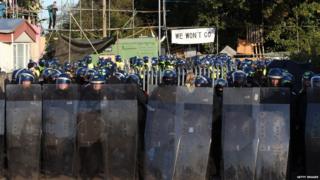 Police lined up at Dale Farm in riot gear