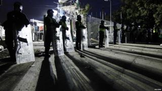 Police stand on guard at Dale Farm