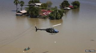 Thai army helicopter drops food to people near Bangkok