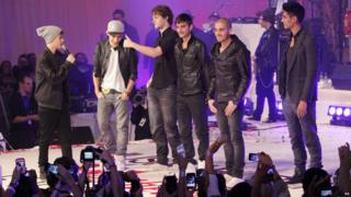 Justin Bieber on stage with The Wanted