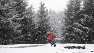 child playing in snow