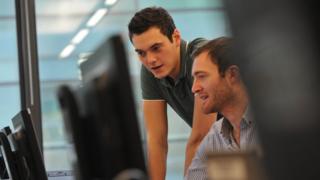 Joe and John by computer monitor
