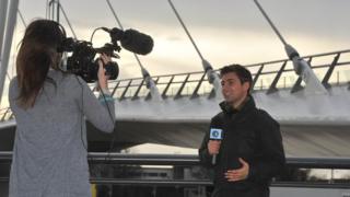 Ricky being filmed by bridge