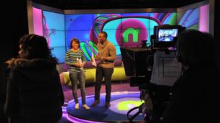 Leah and Ore laughing in the studio