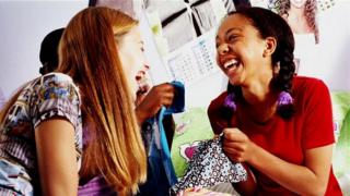 girls laughing together
